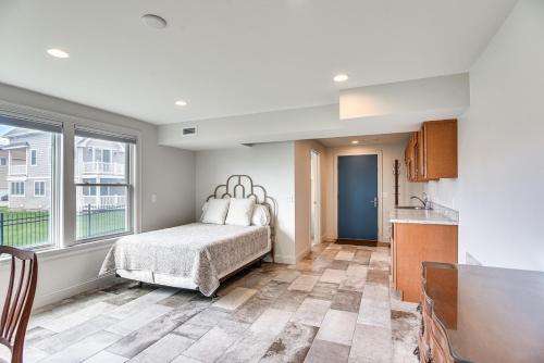 a bedroom with a bed and a large window at Narragansett Home with Scenic Views Walk to Beach! in Narragansett