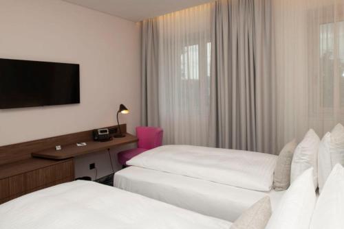Cama o camas de una habitación en Hotel Le Parc