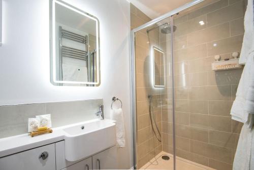 a bathroom with a sink and a shower at The Star Barn in Ingram