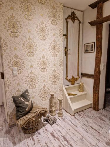 a bathroom with a tub and a sink and a mirror at Ferienhaus Eifelglühen in Monschau
