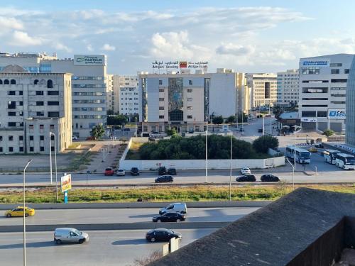 a highway in a city with buildings and cars at Diar Tunis Carthage II in Ariana