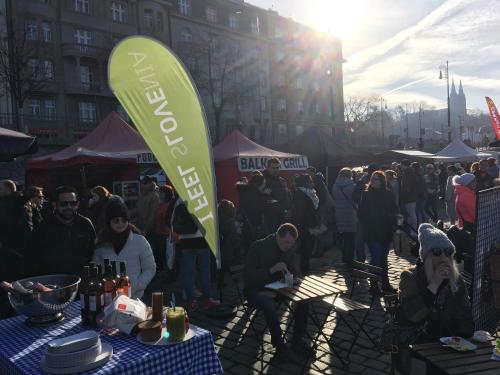 a crowd of people at a farmers market with a sign at Beautiful house in Prague with parking in Prague
