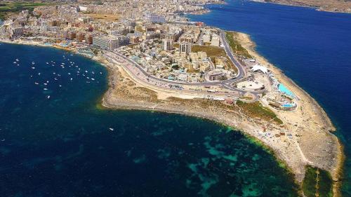 an aerial view of a city and the ocean at B8 Seaside Luxury Rooms with private bathroom - dining area shared in St Paul's Bay