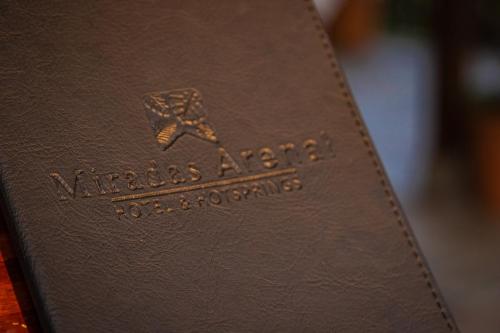a close up of a book with the words nyssas araucania at Miradas Arenal Hotel & Hotsprings in Fortuna