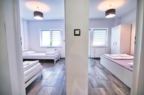 Posteľ alebo postele v izbe v ubytovaní Apartamenty Izabell by Housine