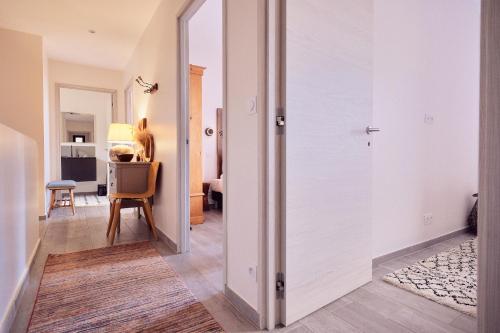 a hallway with a door leading to a living room at Villa avec jardin et piscine in Calvi