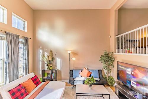 a living room with a couch and a tv at Entire Private 12-Guest 3-Bedroom Townhouse with Garage near San Diego Gaslamp in National City