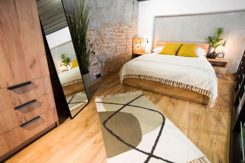 Postel nebo postele na pokoji v ubytování Narnia LOFT