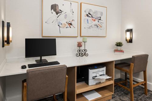a desk with a computer on top of it at Staybridge Suites Minneapolis-Bloomington by IHG in Bloomington