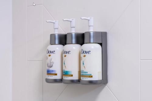 a group of four bottles of dye hair products in a rack at Garner Hotel Clarksville Northeast by IHG in Clarksville