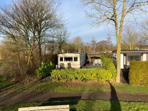 a view of an rv parked in a yard at Chalet G5 it Soal Workum in Workum