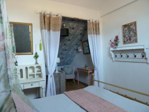 Postel nebo postele na pokoji v ubytování Le Clos Fleuri