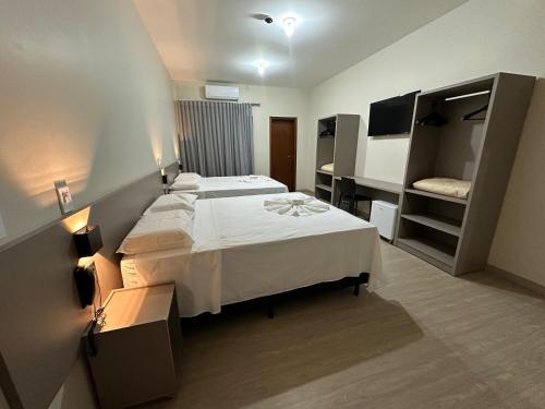 Ліжко або ліжка в номері Amazon Green Hotel