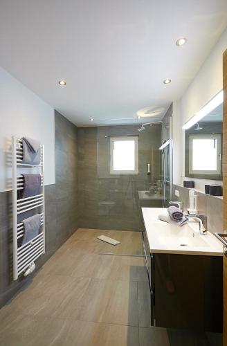 a bathroom with a sink and a shower at Apartment Lina in Gröbming