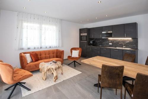 a living room with a couch and a table at Apartment Lina in Gröbming