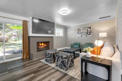 a living room with a couch and a fireplace at 10min to EXPO - Family-Friendly with Office & Playroom in Tulsa