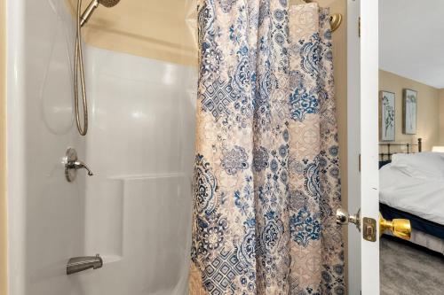 a bathroom with a shower with a shower curtain at 60 Bristol in Bristol