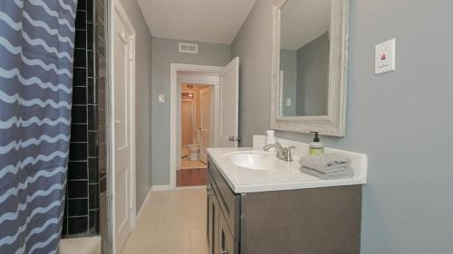 a bathroom with a sink and a shower at Escape to Raleigh Ave 3 Steps from the Beach in Atlantic City