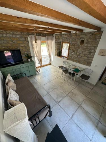 a living room with a couch and a table at Istrian green house in Portorož