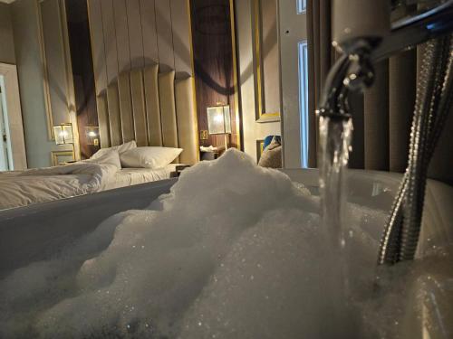 a bathroom with a tub filled with snow at Edgbaston House in Birmingham