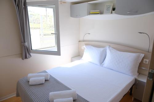 Ένα ή περισσότερα κρεβάτια σε δωμάτιο στο Sunset Beach House
