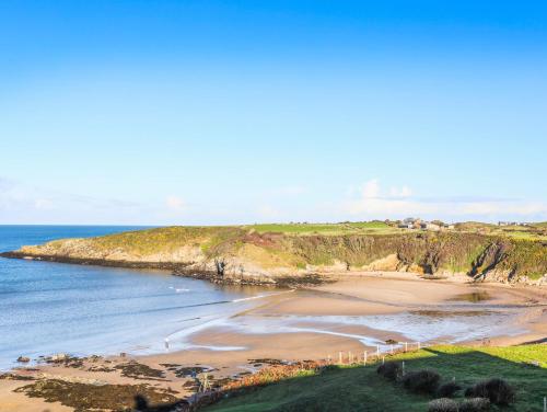 an aerial view of a beach and the ocean at Ty Bara in Cemaes Bay