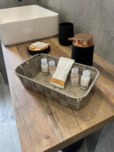 a tray with candles on a table next to a sink at Casa di Ale in Tivoli