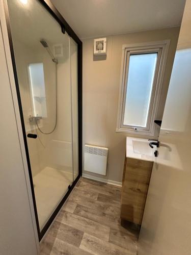 a bathroom with a sink and a shower at MOBIL HOME saint Raphael camping l’île d’or in Saint-Raphaël