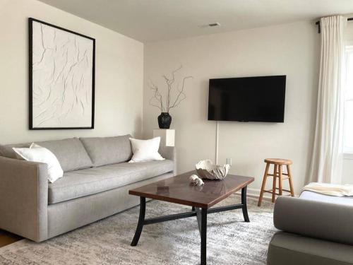 a living room with a couch and a coffee table at North Beach Retreat in Atlantic City