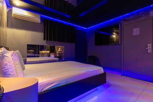 Ένα ή περισσότερα κρεβάτια σε δωμάτιο στο Point Motel GRU