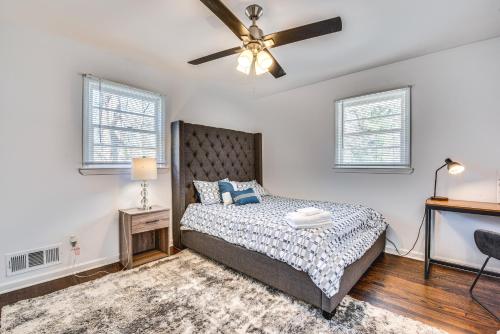 a bedroom with a bed and a ceiling fan at Charming Atlanta Home with Yard 7 Mi to Downtown! in Atlanta