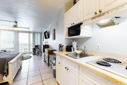 a kitchen with a sink and a counter top at Daytona Delight in Daytona Beach