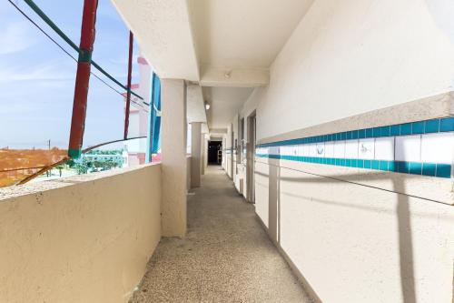 an empty hallway of a building with a view at Daytona Delight in Daytona Beach