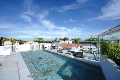 a swimming pool on the roof of a house at Charming 2BR With Pool in Casco Antiguo in Panama City