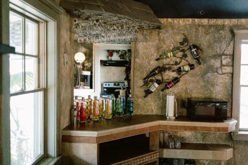 a bar with a bunch of bottles on the wall at Full Building No Cleaning Fee Everythings Close in Lake Geneva