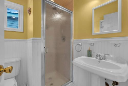 a bathroom with a shower and a sink and a toilet at Short Walk to the Beach! in Keansburg