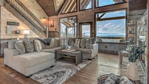 a living room with a couch and a table at Clocking Inn in Mineral Bluff