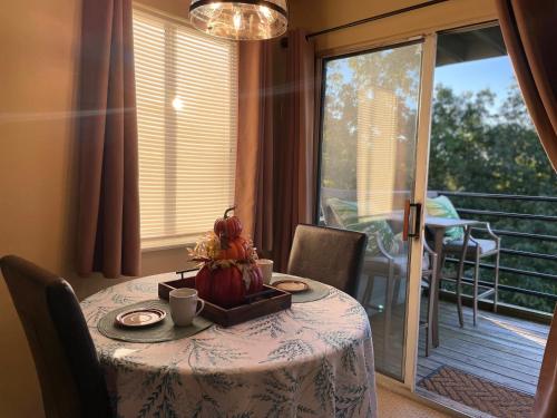 a table with a bowl of fruit on top of it at Gatlinburg Summit Getaway for 2 With Amazing View! in Gatlinburg