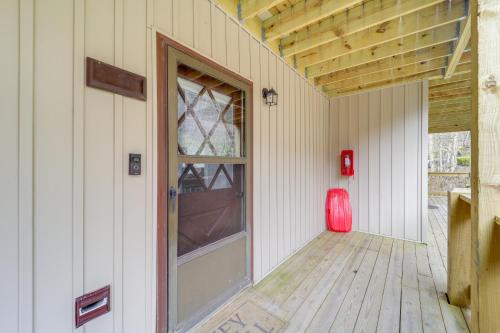 an empty room with a door and a window at Beech Mountain Studio with Balcony Less Than 1 Mi to Skiing! in Beech Mountain