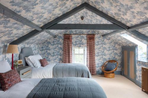 a bedroom with two beds in a attic at The Old Rectory in Brampton