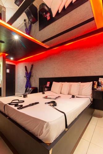 Ένα ή περισσότερα κρεβάτια σε δωμάτιο στο Point Motel GRU