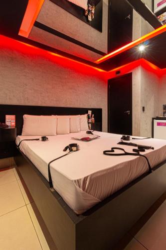 Ένα ή περισσότερα κρεβάτια σε δωμάτιο στο Point Motel GRU