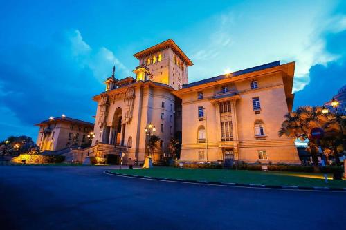 a large building with a tower on top of it at Lux 3BR Suite Puteri Harbour Near Legoland & Hello Kitty in Nusajaya