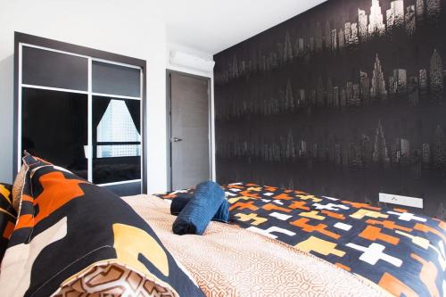 a bedroom with a bed with a mural of cities at Modern, High Floor Suasana Suites 05 in JB in Johor Bahru