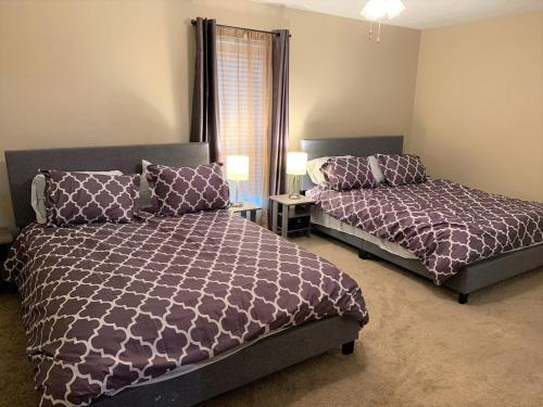 a bedroom with two beds and a window at 290/Cypress/NW Houston/Pets/NewListing in Cypress