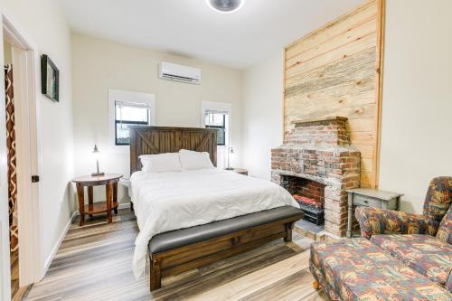 a bedroom with a bed and a fireplace at Abbeville Cabin on 450 Acres Near Lake Eufaula! in Abbeville