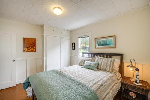 a bedroom with a bed and a window at Beautiful Birch Bay Retreat with Deck and Fire Pit! in Blaine