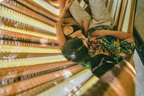 a man and a woman sitting on a staircase at Villas Zamna - Jungle Villas in Cozumel
