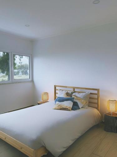 Säng eller sängar i ett rum på Monte da Boavista