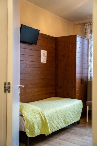 Ένα ή περισσότερα κρεβάτια σε δωμάτιο στο Azienda Agrituristica Ai Prai